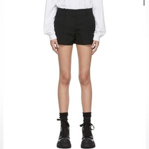 Brand new and unworn ACNE STUDIOS black tailored mini shorts in size 36 (US 26)